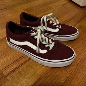 Burgundy low top Vans sneakers